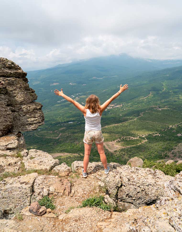 Girl standing on mountain